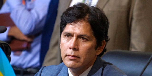 Los Angeles City Council member Kevin de Leon sits in chamber before starting the Oct. 11 Los Angeles City Council meeting. The councilman is resisting calls to resign amid a public outcry.