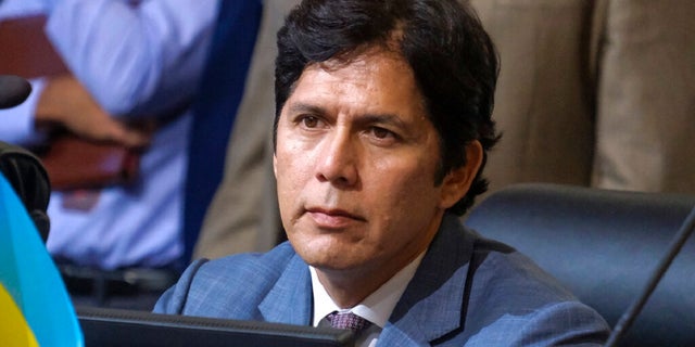 Los Angeles City Council member Kevin de Leon sits in chamber before starting the Oct. 11 Los Angeles City Council meeting. The councilman is resisting calls to resign amid a public outcry.