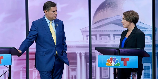 Massachusetts Republican Geoff Diehl, left, speaks with Massachusetts Democratic Attorney General Maura Healey, right, before their televised debate for governor, Wednesday, Oct. 12, 2022, at NBC10 Boston television studios, in Needham, Mass. 