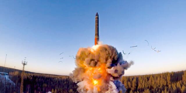 FILE - In this file photo taken from a video distributed by Russian Defense Ministry Press Service, on Dec. 9, 2020, a ground-based intercontinental ballistic missile was launched from the Plesetsk facility in northwestern Russia.