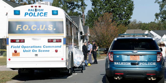 Police remain on the scene at Castle Pines Dr. and Sahalee Way following a shooting Thursday night in Raleigh, N.C., on Friday, Oct. 14, 2022.