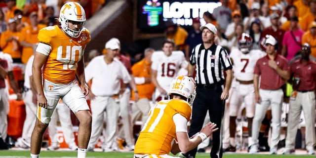 Tennessee place kicker Chase McGrath (40) readies to kick a last second field goal as holder Paxton Brooks (37) waits to snap during the second half of an NCAA college football game against Alabama Saturday, Oct. 15, 2022, in Knoxville, Tenn. Tennessee won 52-49. 