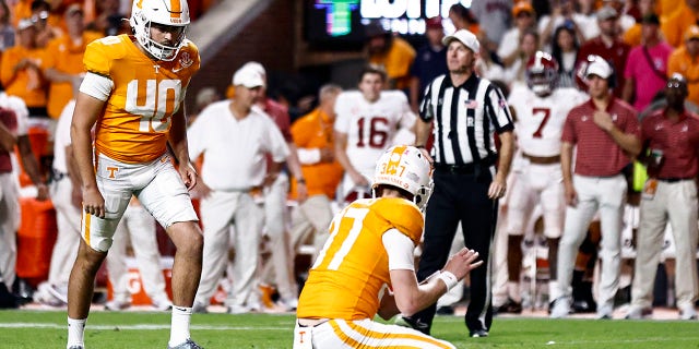 Tennessee place kicker Chase McGrath (40) readies to kick a last second field goal as holder Paxton Brooks (37) waits to snap during the second half of an NCAA college football game against Alabama Saturday, Oct. 15, 2022, in Knoxville, Tenn. Tennessee won 52-49. 