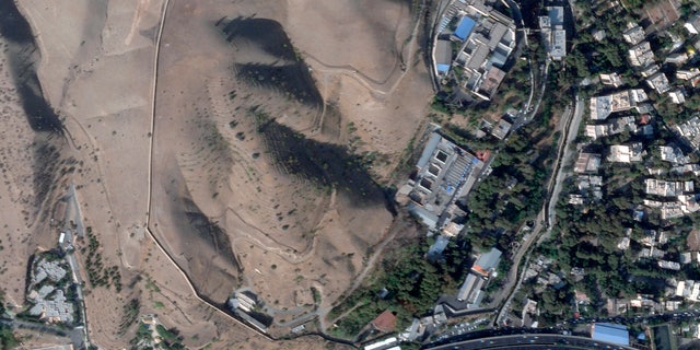This satellite photo by Planet Labs PBC shows Evin Prison in Tehran, Iran on Sunday, October 16, 2022, after a fire in the complex amid ongoing national protests in the country.  The Iranian judiciary raised the death toll on Monday, October 17, 2022, in a prison fire, saying at least eight prisoners were killed. 