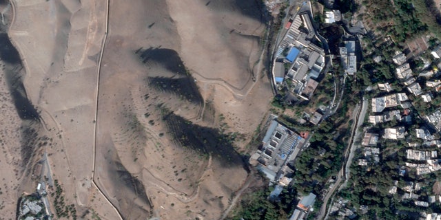 This satellite photo by Planet Labs PBC shows Evin Prison in Tehran, Iran on Sunday, October 16, 2022, after a fire in the complex amid ongoing national protests in the country.  The Iranian judiciary raised the death toll on Monday, October 17, 2022, in a prison fire, saying at least eight prisoners were killed. 