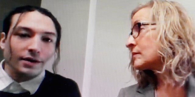 Actor Ezra Miller is seen seated alongside their attorney Lisa Shelkrot, as they appear virtually in a Vermont court.