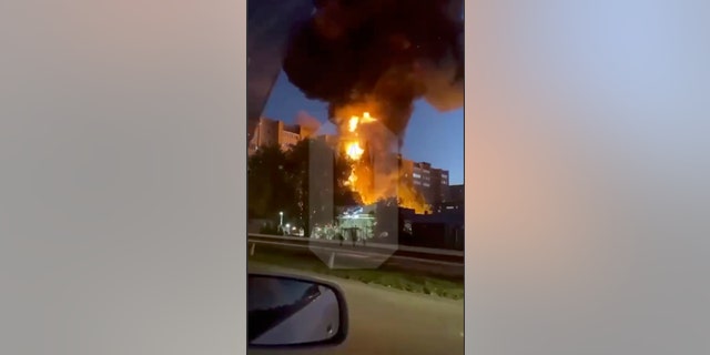 In this handout photo taken from video released by OSTOROZHNO NOVOSTI, flames and smoke rise from the scene where a warplane crashed into a residential area in Yeysk, Russia, Monday, Oct. 17, 2022. 