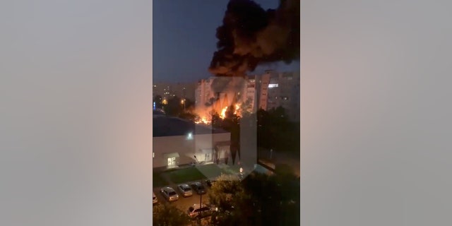 In this posted photo taken from a video released by Ostorozhno Novosty, fire and smoke engulf a building after a warplane crashes in a residential area of Yeysk, Russia, on Monday, October 17, 2022.
