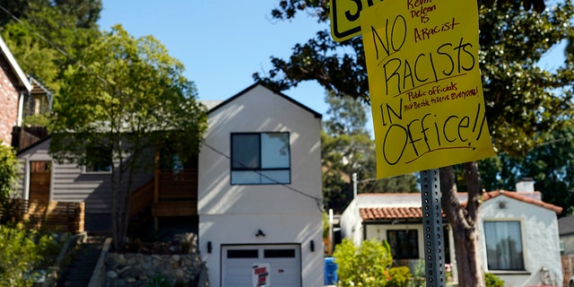 A sign condemning Los Angeles City Council member Kevin de León is posted across the street from his home in Los Angeles, Tuesday, Oct. 18, 2022. 