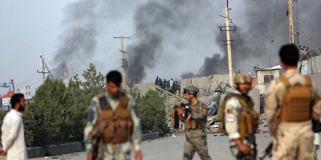 Smoke billows from the Green Village, home to several international organizations and guesthouses, in Kabul, Afghanistan, Tuesday, Sept. 3, 2019. 