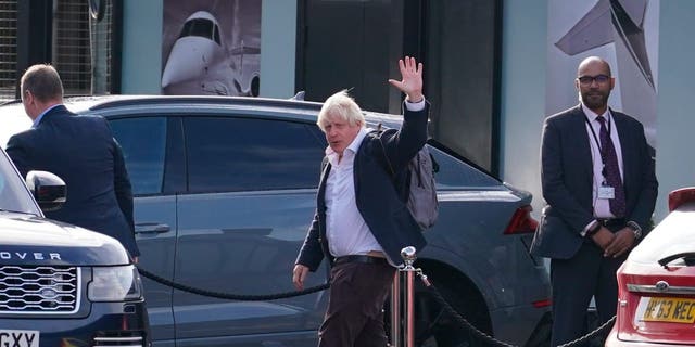 Former Prime Minister Boris Johnson arrives at Gatwick Airport in London, after travelling on a flight from the Caribbean, following the resignation of Liz Truss as Prime Minister, Saturday Oct. 22, 2022. 