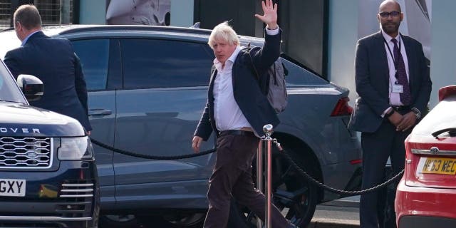 Former Prime Minister Boris Johnson arrives at Gatwick Airport in London, having traveled on a flight from the Caribbean, following the resignation of Liz Truss as prime minister on Saturday 22 October 2022. 