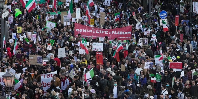 People attend a protest against the Iranian regime, in Berlin, Germany, Saturday, Oct. 22, 2022, following the death of Mahsa Amini in the custody of the Islamic republic's notorious "morality police."