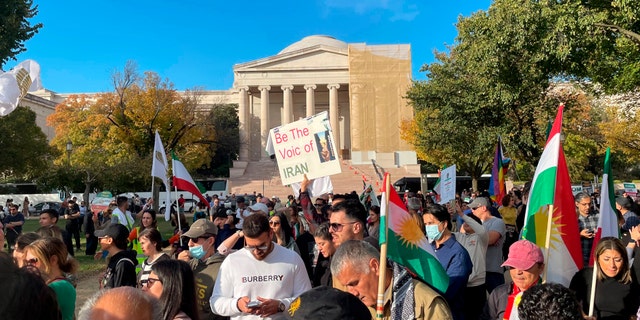 Hundreds of people attend a rally on Saturday, Oct. 22, 2022, in Washington in a show of international support for demonstrators facing a violent government crackdown in Iran, sparked by the death of 22-year-old Mahsa Amini in the custody of that country's morality police.