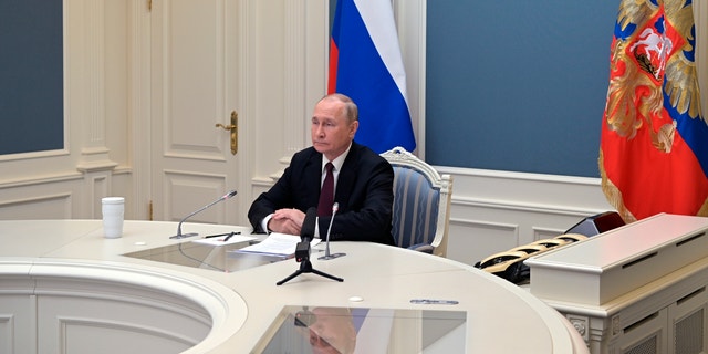 Russian President Vladimir Putin attends training to test strategic deterrence forces via video conference in Moscow on October 26, 2022. 