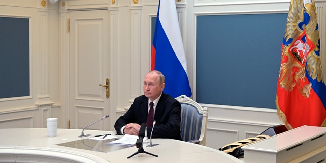 Russian President Vladimir Putin attends training to test strategic deterrence forces via video conference in Moscow on October 26, 2022. 