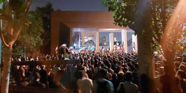 In this photo, taken by a non-Associated Press individual and obtained by the AP outside Iran, students at Sharif University of Technology witness a protest sparked by the death in September of 22-year-old Mahsa Amini in custody. of the country's moral police, in Tehran, on Friday 7 October 2022. 