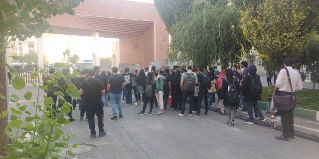 In this photo, taken by a non-Associated Press individual and obtained by the AP outside Iran, students at Sharif University of Technology witness a protest sparked by the death in September of 22-year-old Mahsa Amini in custody. of the country's moral police, in Tehran, on Friday 7 October 2022. 