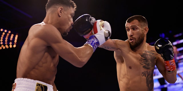 Vasiliy Lomachenko, right, punches Jamaine Ortiz during a lightweight boxing match Saturday, Oct. 29, 2022, in New York. 