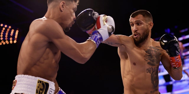 Vasiliy Lomachenko, right, punches Jamaine Ortiz during a lightweight boxing match Saturday, Oct. 29, 2022, in New York.