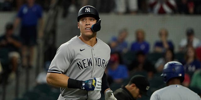 New York Yankees slugger Aaron Judge heads to the dugout after grounding out during the first inning of the first game of a doubleheader against the Texas Rangers in Arlington, Texas, on Tuesday.