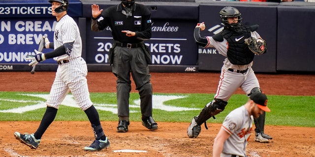 New York Yankees' Aaron Judge, left, reacts after striking out during the seventh inning of a baseball game against the Baltimore Orioles, Sunday, Oct. 2, 2022, in New York.