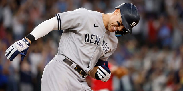 Aaron Judge of the New York Yankees rounds the bases after hitting his 62nd home run of the season against the Rangers at Globe Life Field on Oct. 4, 2022, in Arlington, Texas.