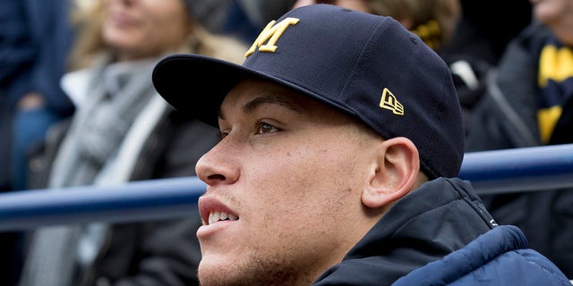 New York Yankees of Major League outfielder Aaron Judge watches the game between the Michigan Wolverines and the Ohio State Buckeyes from the field level at Michigan Stadium in Ann Arbor, Michigan, on Nov. 25, 2017.