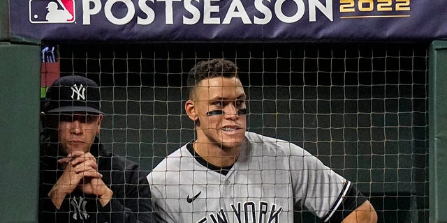 New York Yankees center fielder Aaron Judge watches play from the dugout during the second inning in Game 2 of baseball's American League Championship Series between the Houston Astros and the New York Yankees, Thursday, Oct. 20, 2022, in Houston.