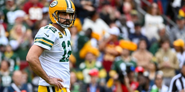 Green Bay Packers quarterback Aaron Rodgers, #12, reacts against the Washington Commanders during the first half at FedExField Oct. 23, 2022 in Landover, Maryland.