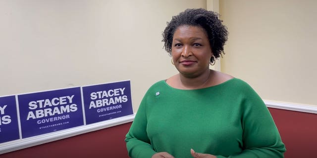 Democratic Georgia gubernatorial nominee Stacey Abrams speaks with Fox News' Brandon Gillespie following a rally with the Asian-American community in Gwinnett County, Georgia on Oct. 7, 2022.