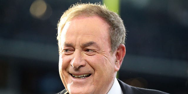 Al Michaels on the field before a game