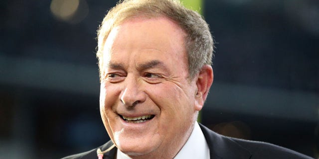 Al Michaels on the field before a game