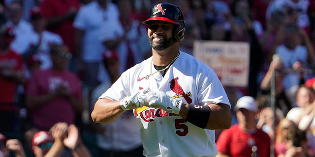 St. Louis Cardinals' Albert Pujols celebrates after hitting a solo home run during the third inning of a baseball game against the Pittsburgh Pirates Sunday, Oct. 2, 2022, in St. Louis. 