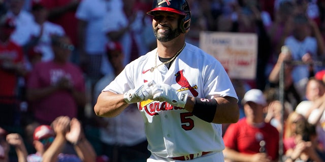 St. Louis Cardinals' Albert Pujols celebrates after hitting a solo home run during the third inning of a baseball game against the Pittsburgh Pirates Sunday, Oct. 2, 2022, in St. Louis.