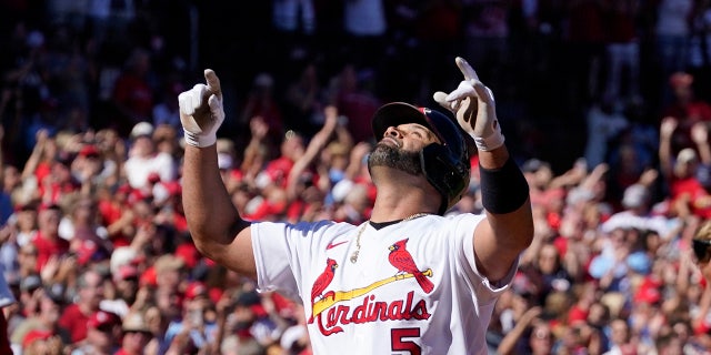 St. Louis Cardinals' Albert Pujols celebrates after hitting a solo home run during the third inning of a baseball game against the Pittsburgh Pirates Sunday, Oct. 2, 2022, in St. Louis.