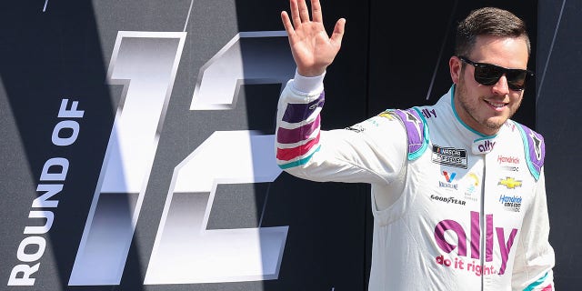 Alex Bowman, driver of the #48 Ally Chevrolet, waves to fans walks onstage during driver intros prior to the NASCAR Cup Series Auto Trader EchoPark Automotive 500 at Texas Motor Speedway on Sept. 25, 2022 in Fort Worth, Texas.