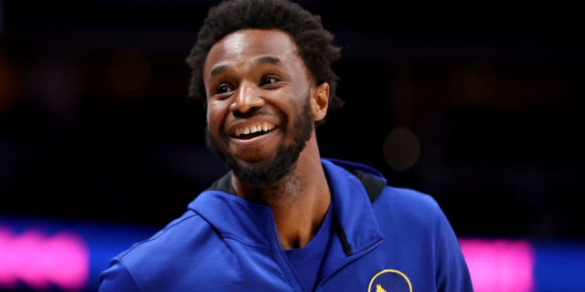 Andrew Wiggins of the Golden State Warriors warms up against the Denver Nuggets at Ball Arena March 10, 2022, in Denver, Colo.
