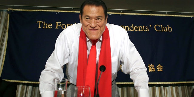 Kanji from Japanese professional wrestler turned politician "Antonio" Inoki bows at the end of a press conference held at the Foreign Correspondents Club of Japan in Tokyo on August 21, 2014.