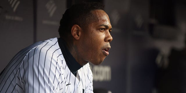 Aroldis Chapman #54 of the New York Yankees looks on from the dugout in the seventh inning during the game between the Baltimore Orioles and the New York Yankees at Yankee Stadium on Sunday, October 2, 2022 in New York.
