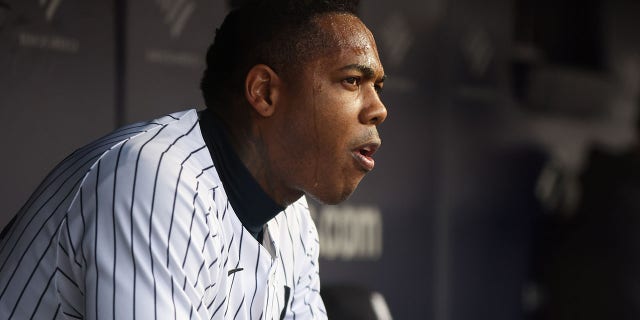 Aroldis Chapman #54 of the New York Yankees looks on from the dugout in the seventh inning during the game between the Baltimore Orioles and the New York Yankees at Yankee Stadium on Sunday, October 2, 2022, in New York.