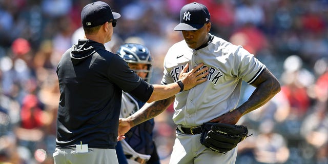 Aroldis Chapman of the New York Yankees is taken out of the game by manager Aaron Boone during the Guardians game at Progressive Field on July 2, 2022, in Cleveland, Ohio.
