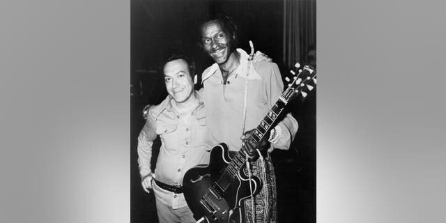 Art Laboe and rock ‘n’ roll musician Chuck Berry pose for a portrait in circa 1975.