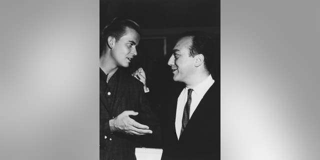 Art Laboe and host of the television show "American Bandstand" Dick Clark chat in 1960.