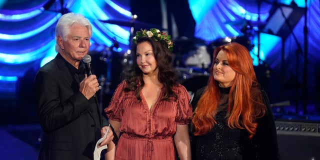 Larry Strickland honored his wife, while Ashley Judd and Wynonna Judd stood side-by-side at her memorial in May.