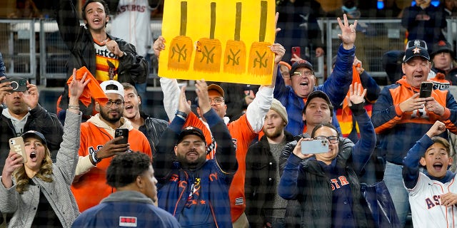 Houston Astros fans celebrate after the Astros beat the New York Yankees 6-5 in Game 4 of the Major League Baseball, Monday, Oct. 24, 2022, in New York.