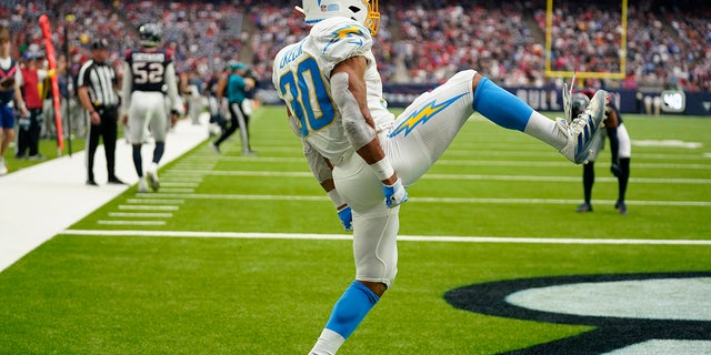 Los Angeles Chargers running back Austin Ekeler (30) celebrates his touchdown against the Houston Texans during the second half of an NFL football game Sunday, Oct. 2, 2022, in Houston.