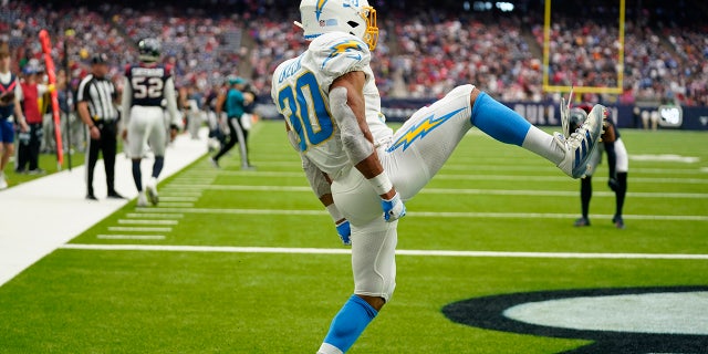 Los Angeles Chargers running back Austin Ekeler (30) celebrates his touchdown against the Houston Texans during the second half of an NFL football game Sunday, Oct. 2, 2022, in Houston.