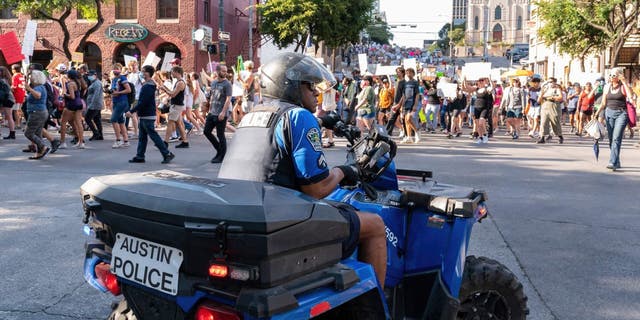 Police enforcement block the streets during a 2022 abortion protest