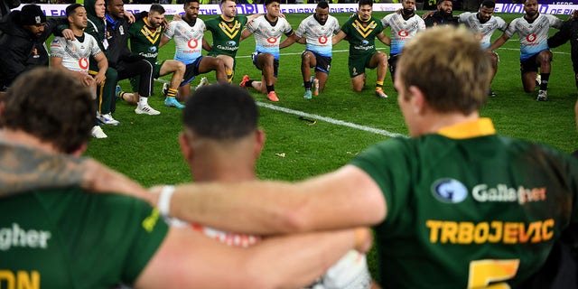 Australia and Fiji players sing together after Rugby League World Cup 2021 Pool B match between Australia and Fiji at Headingley on October 15, 2022, in Leeds, England.